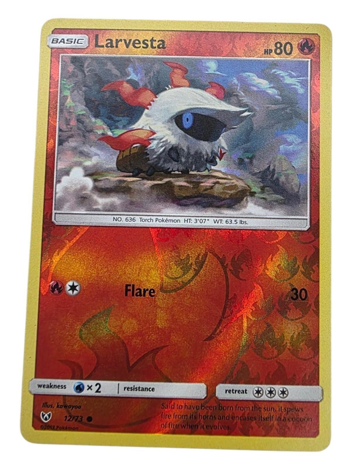 Larvesta 12/73 Shining Legends Pokémon card with foil fire pattern and white-haired character.