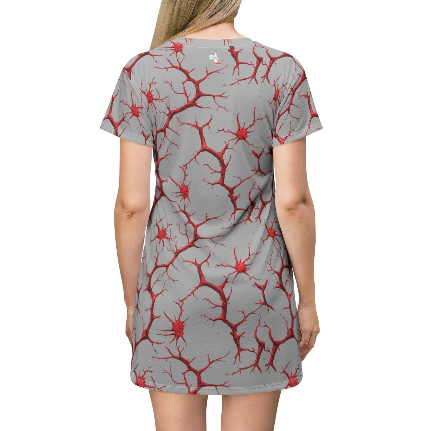 Back view of a grey t-shirt dress with an all-over red branching pattern.