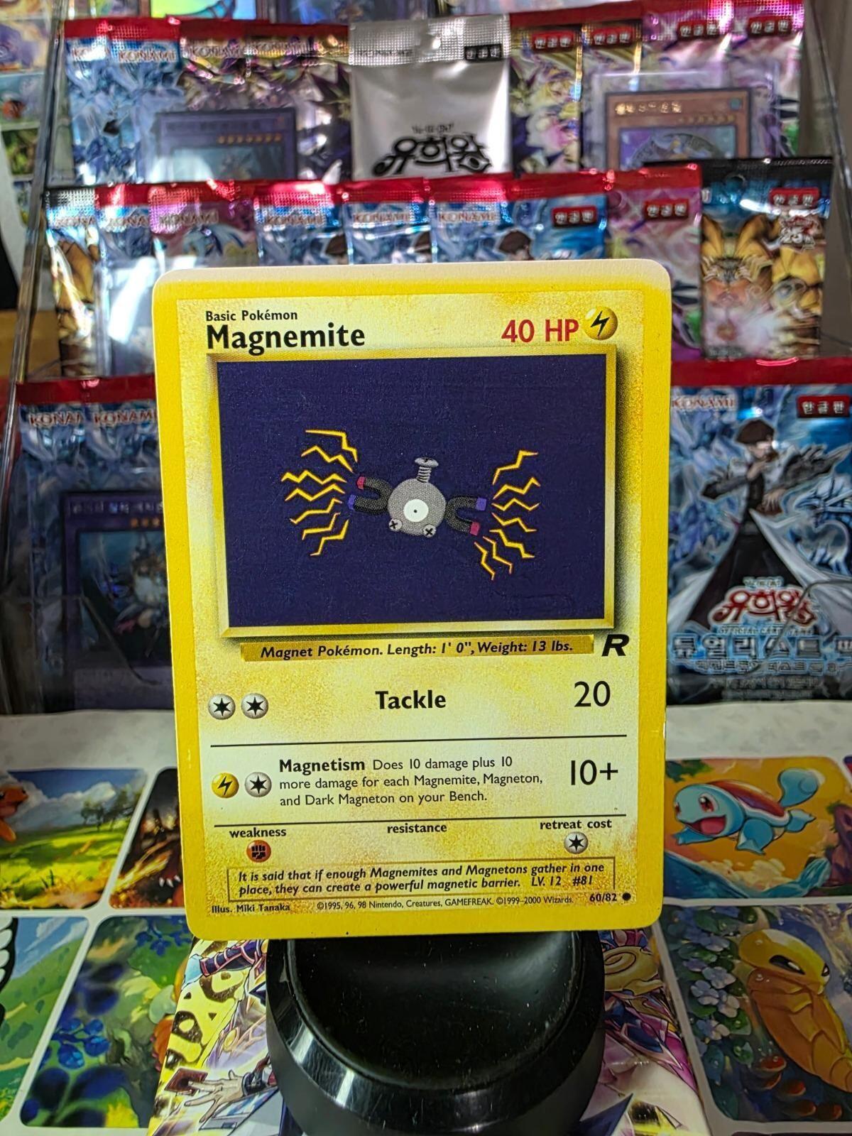 Magnemite 60/82 Team Rocket common Pokémon card with yellow border and purple artwork background.