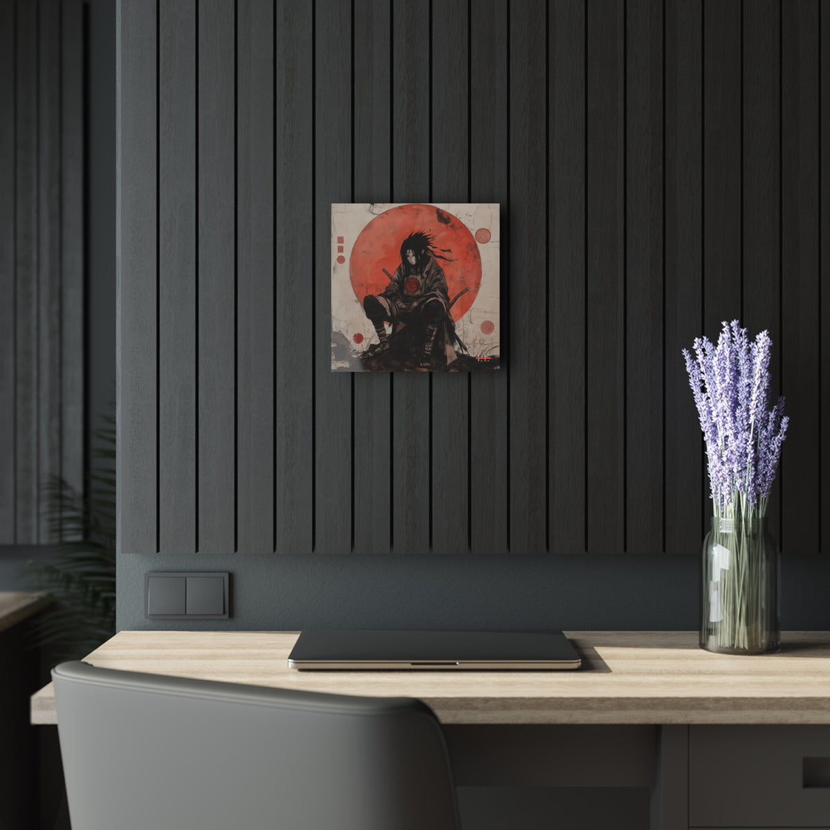 Ghost of the Uchiha acrylic wall art hanging on a black slatted wall above a desk.