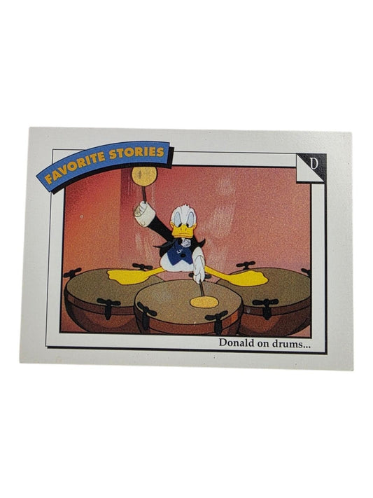 1991 Disney Donald Duck trading card featuring Donald playing drums, with blue, yellow, and white text.