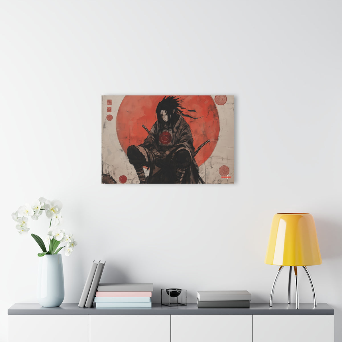 Ghost of the Uchiha acrylic wall art hanging above a credenza with flowers and a lamp.