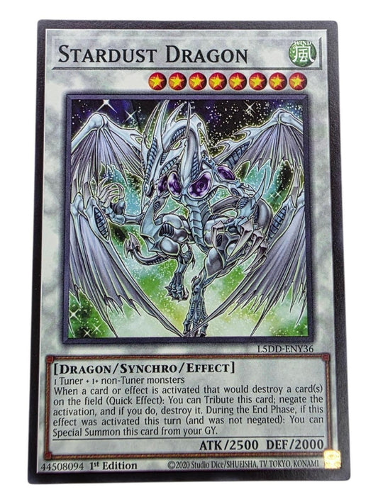 Stardust Dragon Yu-Gi-Oh card featuring white dragon artwork, level 8 stars, and printed text.