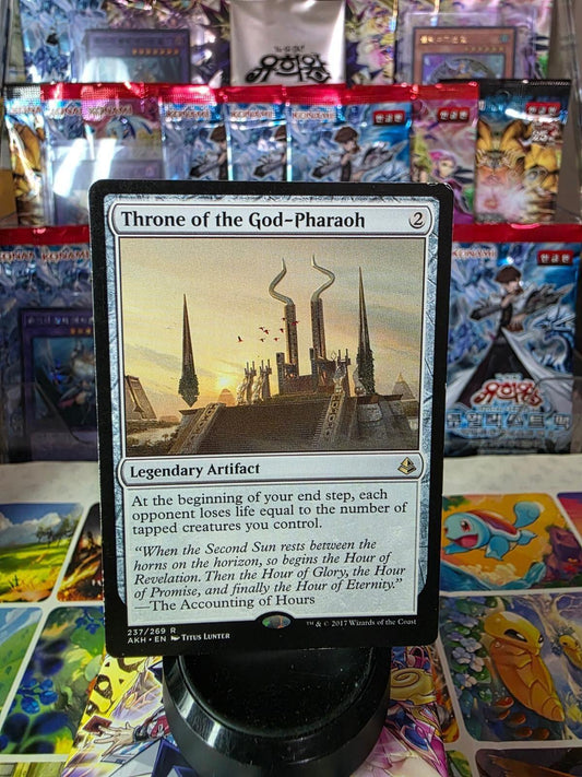Throne of the God-Pharaoh foil Magic: The Gathering card on display.