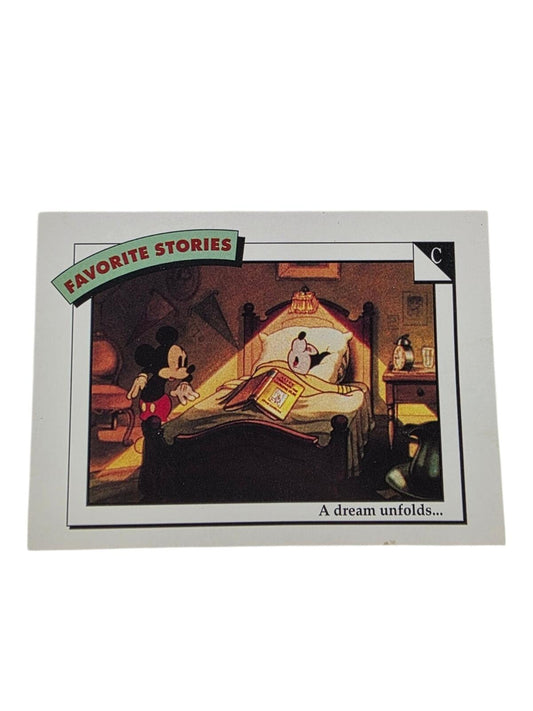 1991 Mickey Mouse trading card titled "Favorite Stories" shows Mickey sleeping in bed with a book and awake at the bedside.