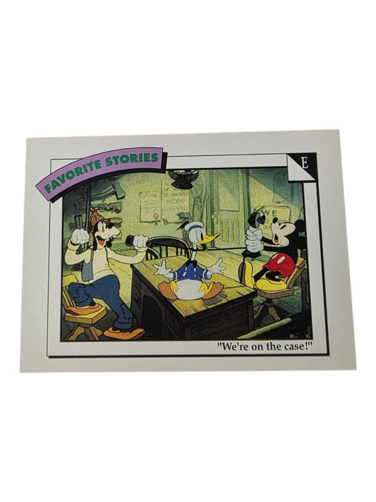 1991 Disney trading card featuring Goofy, Donald Duck, and Mickey Mouse in an office with the text "We're on the case!".