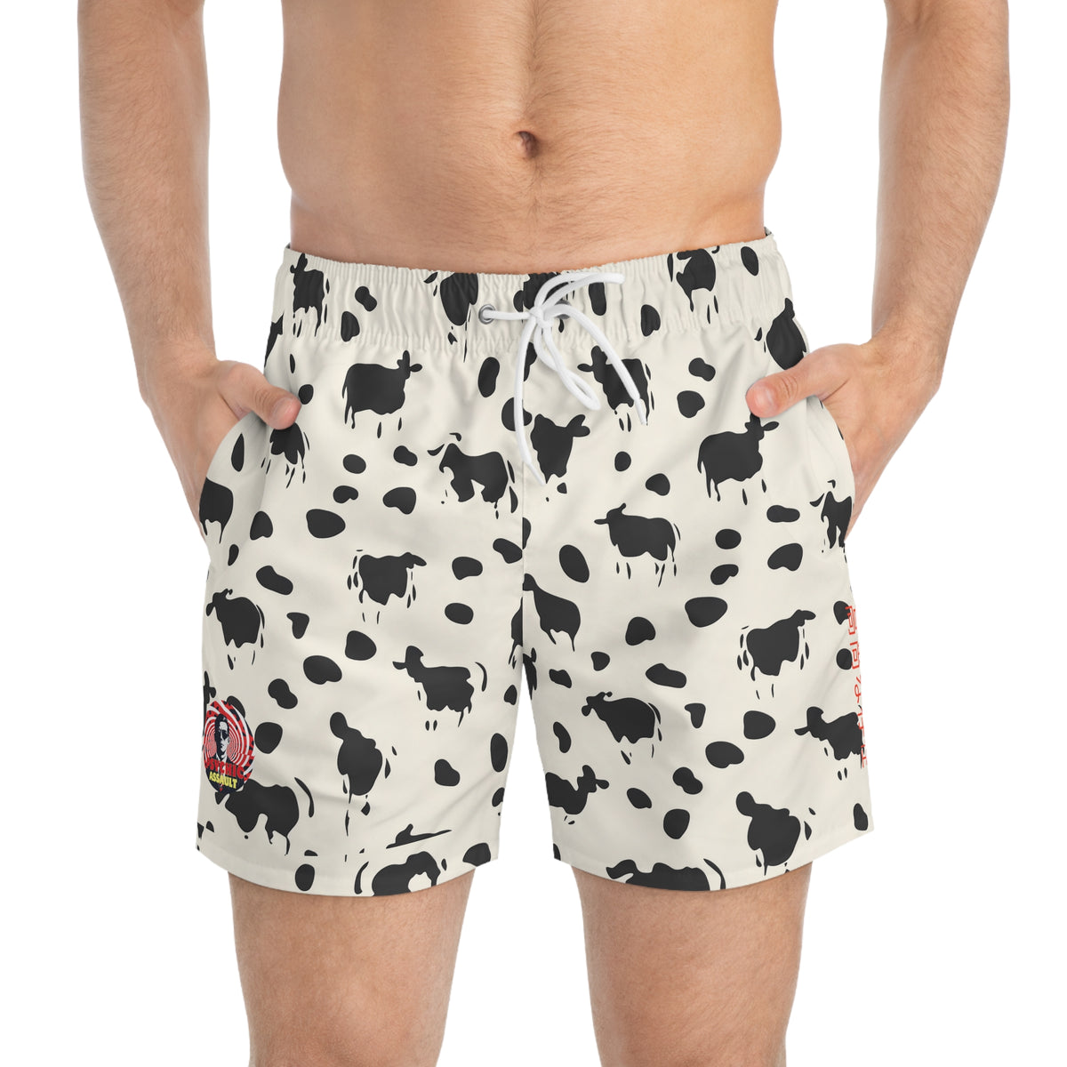 Off-white swim trunks with a black cow and spot print, featuring a white drawstring waist.