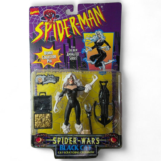 Carded Black Cat action figure in black and white costume with accessories, including a crossbow and briefcase.