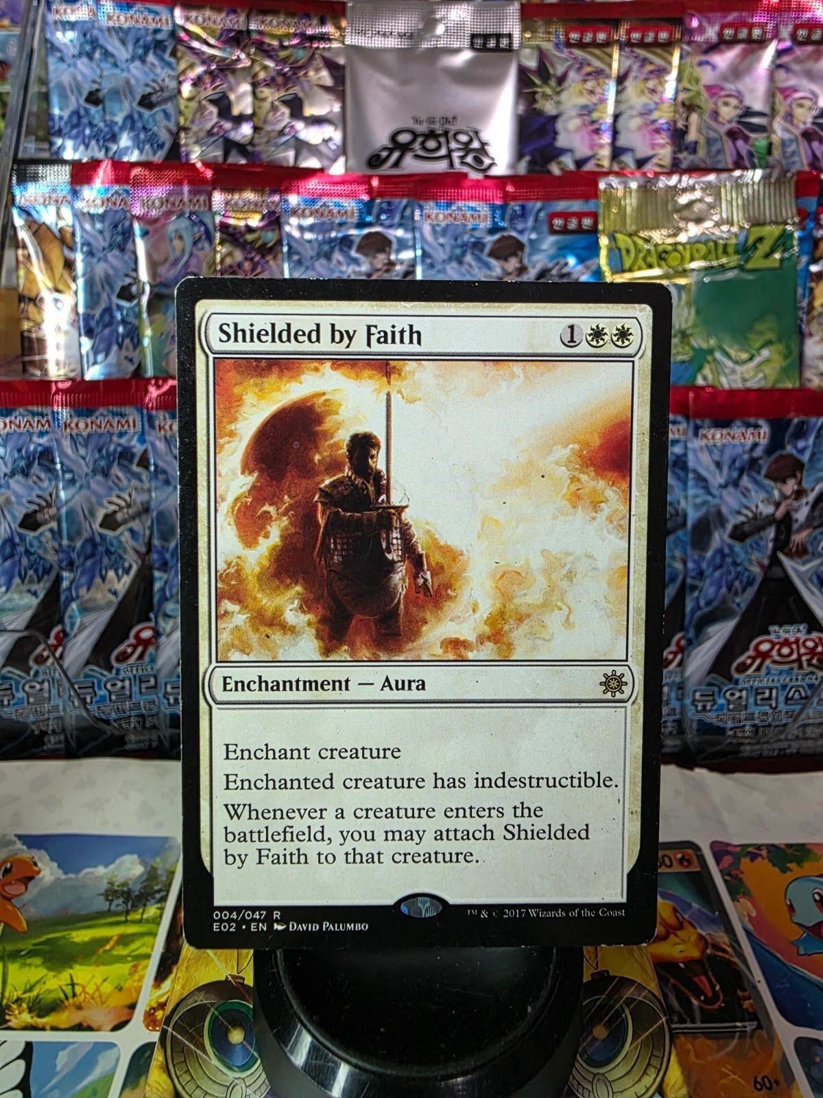 Shielded by Faith Magic card from Explorers of Ixalan in light play condition.
