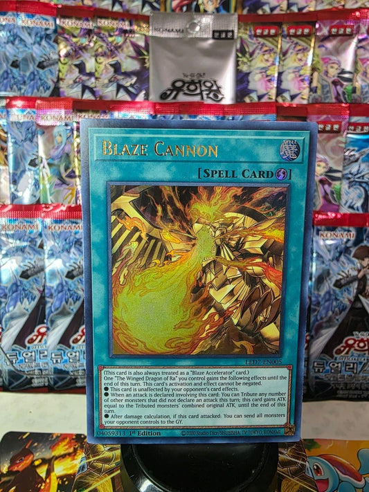 Blaze Cannon 1st Edition Ultra Rare Yu-Gi-Oh! spell card against a background of booster packs.