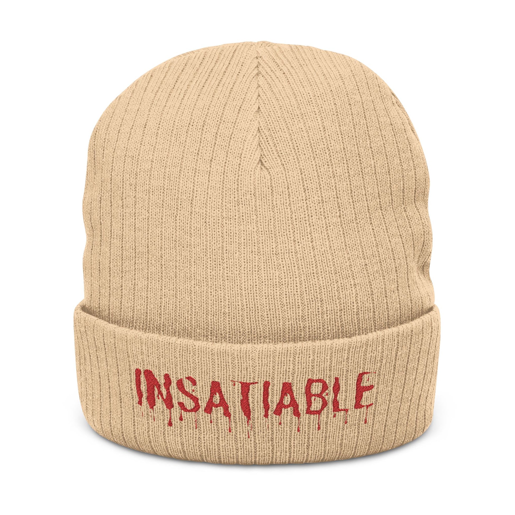 Tan ribbed knit beanie with red embroidered "INSATIABLE" text featuring a dripping design on the cuff.