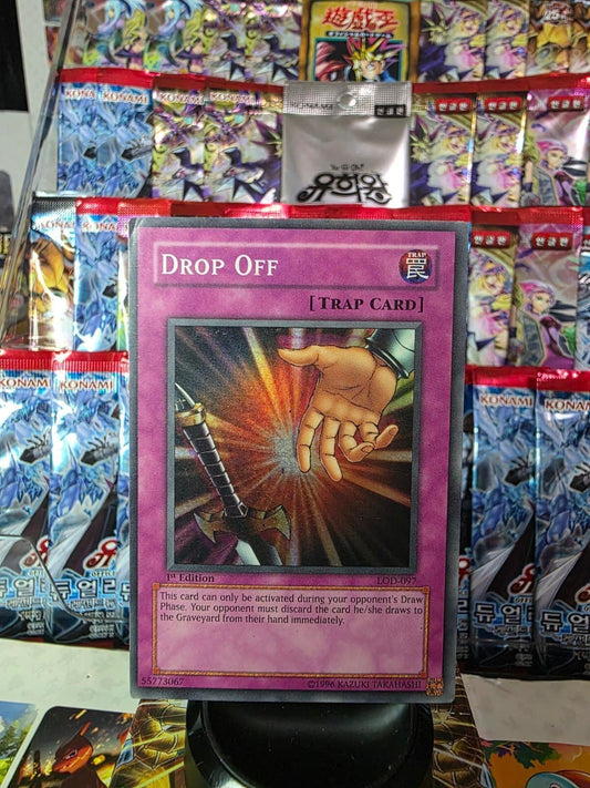 Drop Off 1st Edition Trap Card from Yu-Gi-Oh! displayed upright.