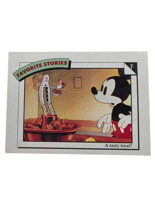 A vintage 1991 Disney trading card titled "FAVORITE STORIES" features Mickey Mouse looking at a nutcracker holding nuts.