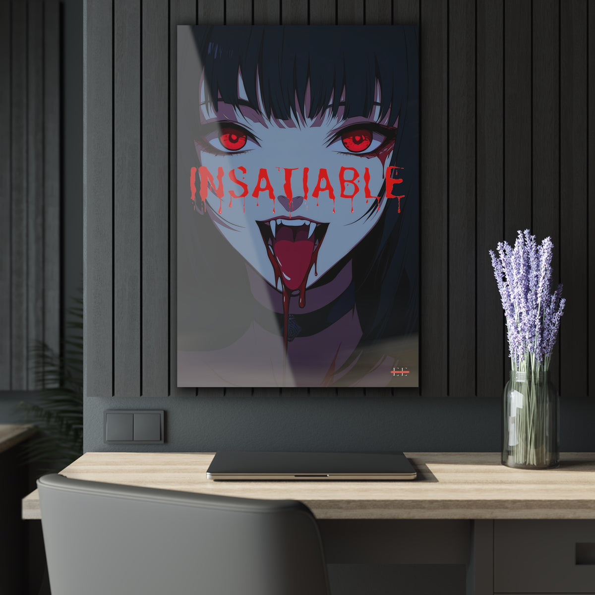 "INSATIABLE" anime vampire acrylic artwork mounted on a dark slatted wall above a wooden desk.
