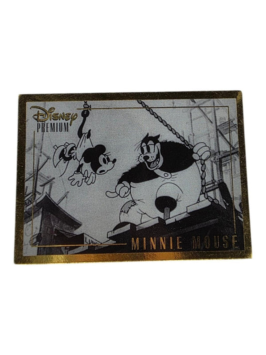 1995 Disney Premium Minnie Mouse trading card in black, white, and gold featuring Minnie Mouse and Peg-Leg Pete.