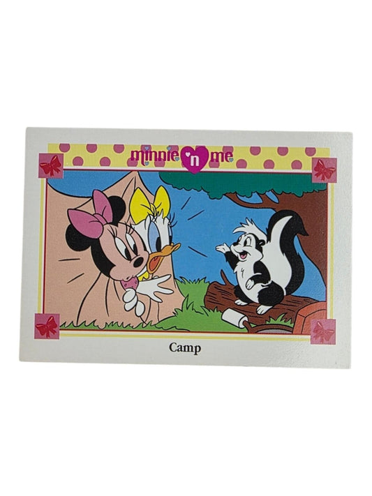 1991 Minnie 'n Me trading card titled "Camp" featuring Minnie and Daisy looking at a skunk.
