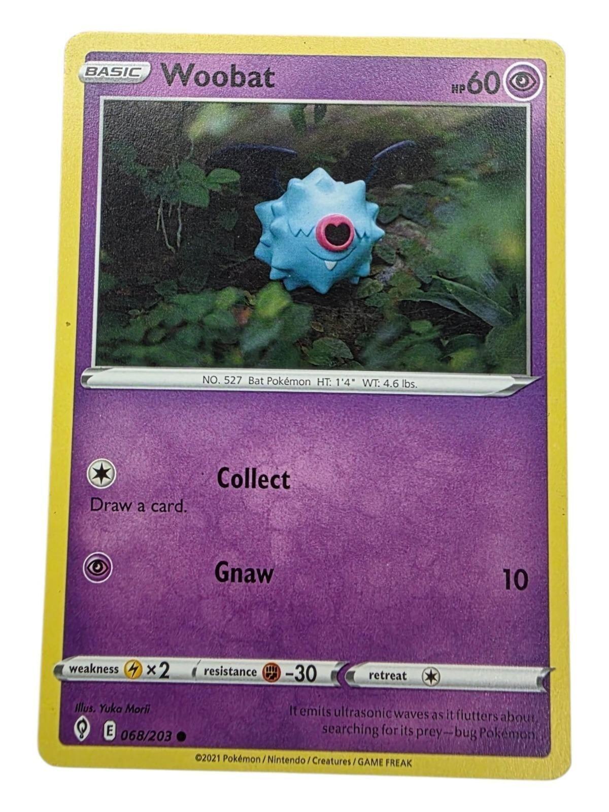 Woobat Common Pokemon card from Evolving Skies showing a blue bat character in foliage.
