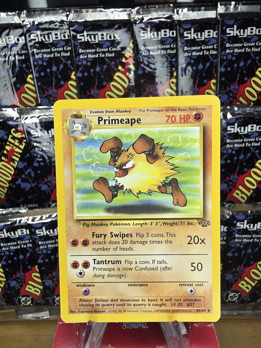 A yellow Primeape Pokémon card showing the angry, brown-furred creature running against a green striped background.
