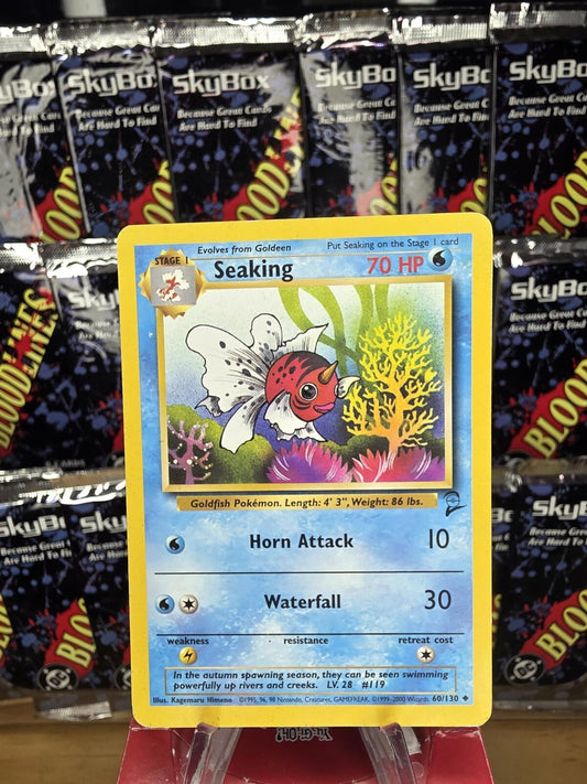 Vintage Seaking Pokémon trading card featuring yellow border, blue water background, and pink and coral coral.