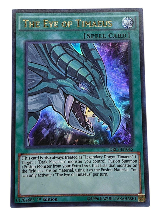 The Eye of Timaeus Yu-Gi-Oh! spell card featuring a green dragon illustration.