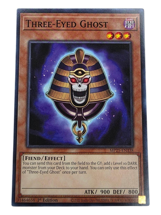 Three-Eyed Ghost Yu-Gi-Oh! card showing a skull amulet with three red eyes against a purple background.