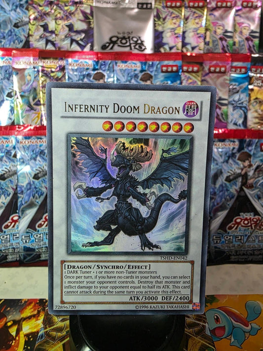 Infernity Doom Dragon trading card in Ultimate Rare foil against a background of foil booster packs.
