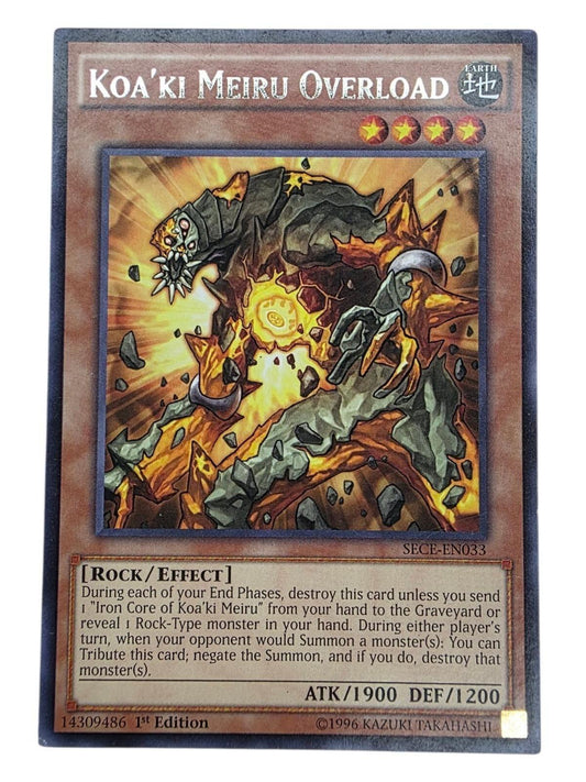 Koa'ki Meiru Overload Yu-Gi-Oh! trading card showing artwork of a rocky monster with glowing orange energy.