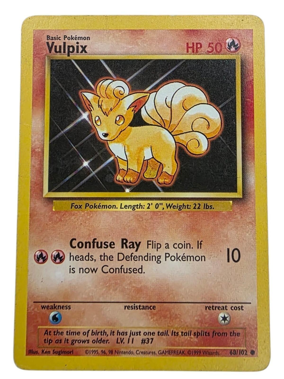 Vulpix Common Base Set 2 Pokémon trading card, featuring orange artwork and stats.