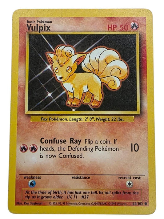Vulpix Common Base Set 2 Pokémon trading card, featuring orange artwork and stats.