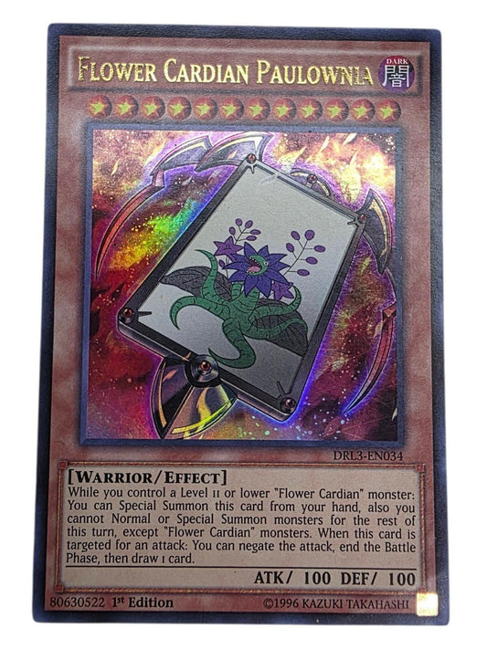 Flower Cardian Paulownia 1st Edition Yu-Gi-Oh! card showing a purple flower monster.