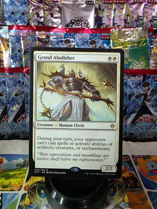 Grand Abolisher Magic card featuring art of an armored warrior with spiked flails against foil booster packs.