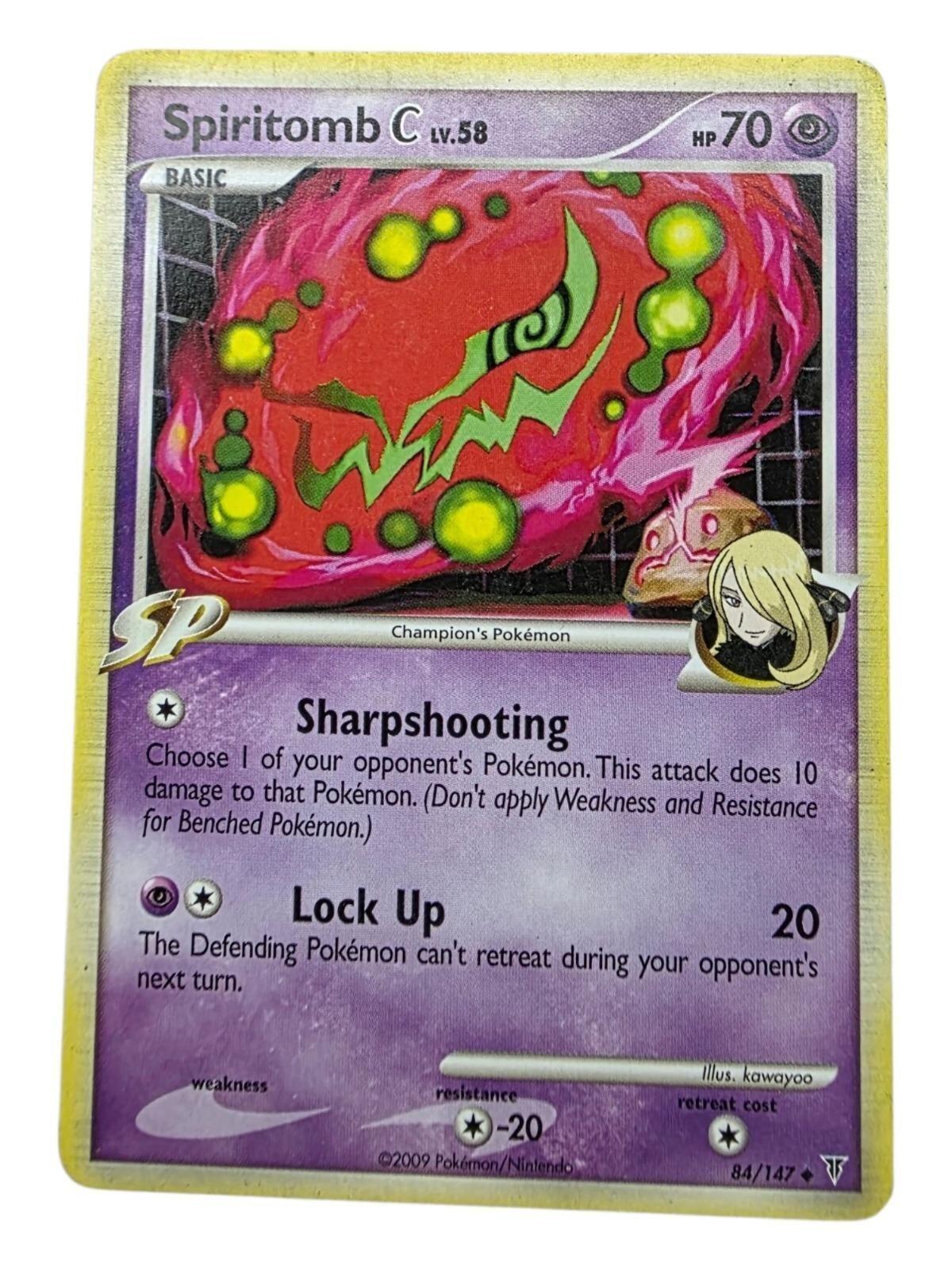 Spiritomb C Lv. 58 Pokémon card with purple background and red artwork featuring green glowing orbs.