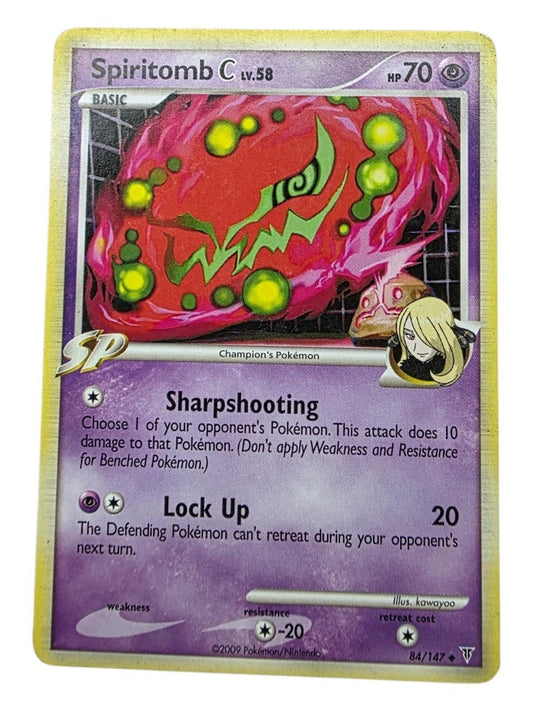 Spiritomb C Lv. 58 Pokémon card with purple background and red artwork featuring green glowing orbs.