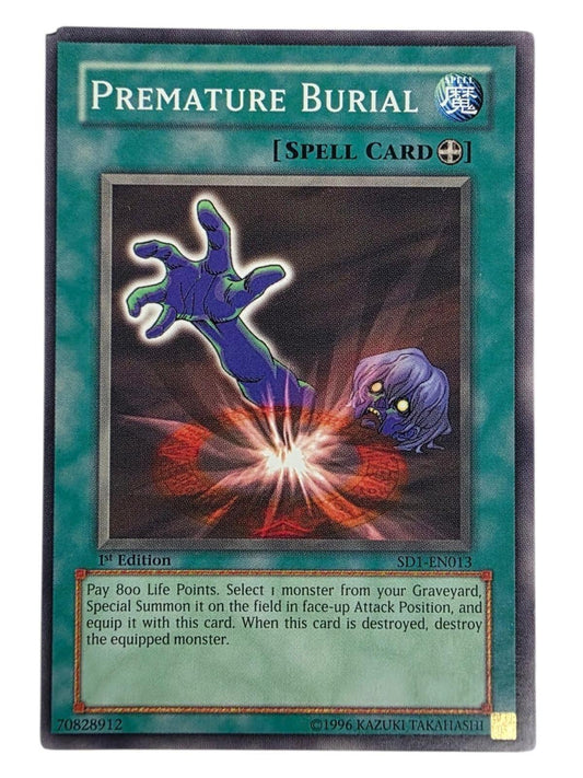 Premature Burial Yu-Gi-Oh! trading card depicting a purple hand and head emerging from the ground.