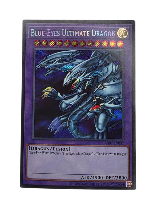 Blue-Eyes Ultimate Dragon Yu-Gi-Oh! trading card featuring three-headed blue dragon artwork against a purple background.