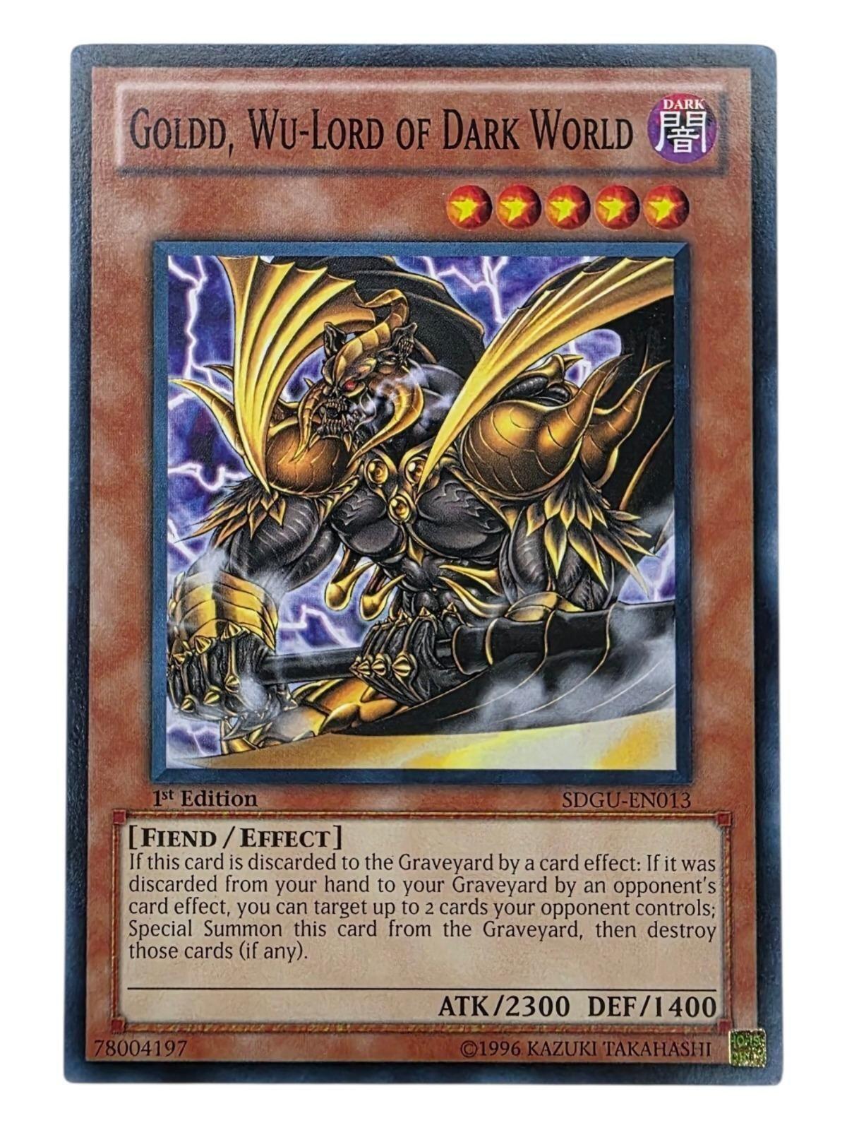 Goldd, Wu-Lord of Dark World Yu-Gi-Oh! card showing a horned fiend in gold and black armor.