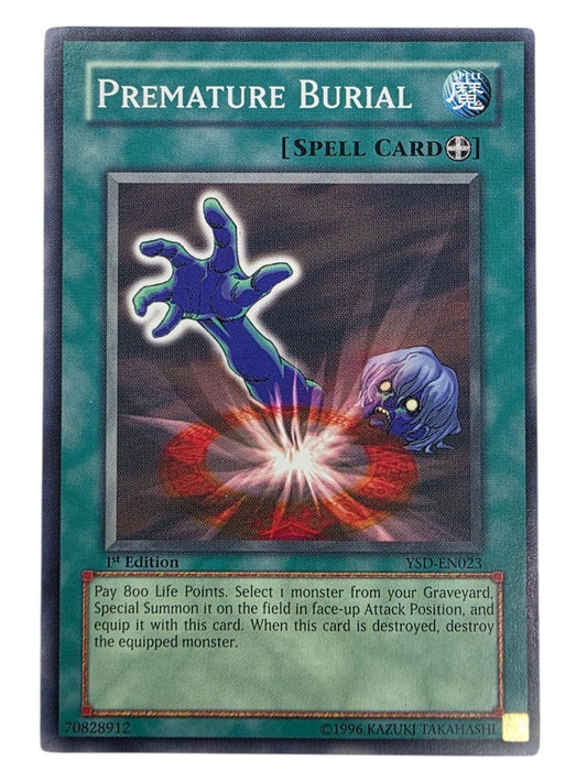 Premature Burial Yu-Gi-Oh! trading card depicting a blue zombie arm reaching from a grave.