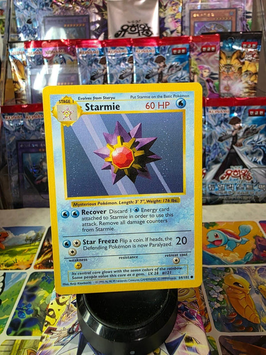 Starmie 064/102 Base Set Pokémon card featuring artwork of the purple starfish creature with a red core.