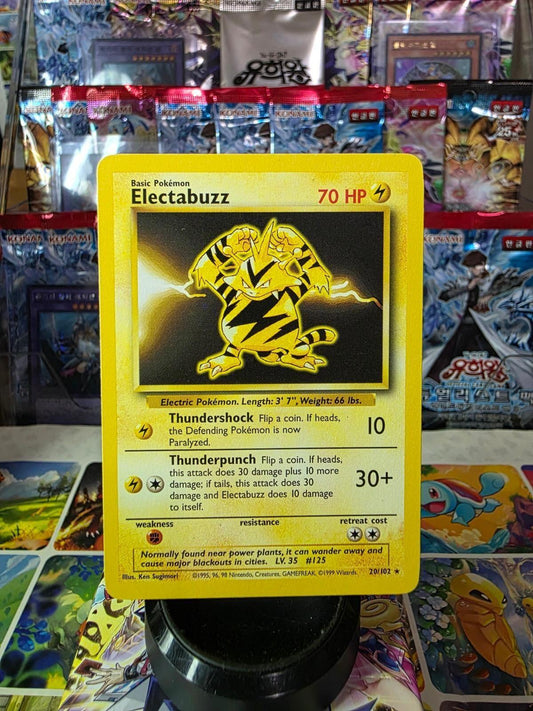 Electabuzz Base Set 20/102 Pokemon card with yellow border and character art.