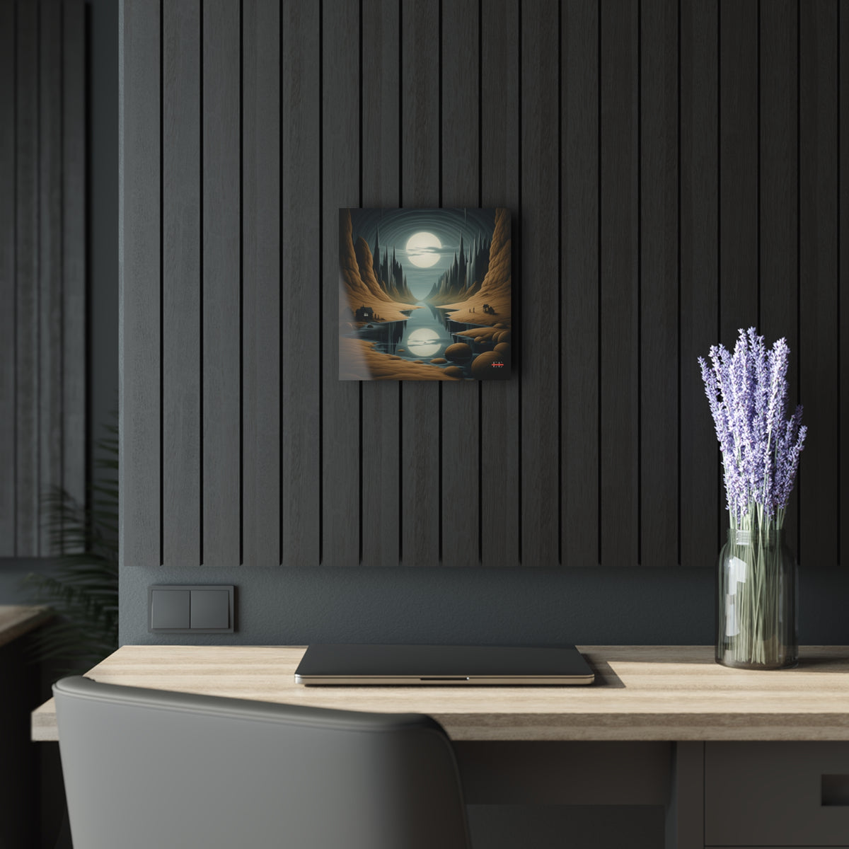 Square acrylic wall art depicting a surreal canyon landscape with a glowing moon, mounted on a dark slatted wall.