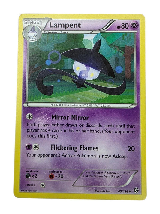 Lampent psychic-type Pokémon trading card showing the character in a forest.