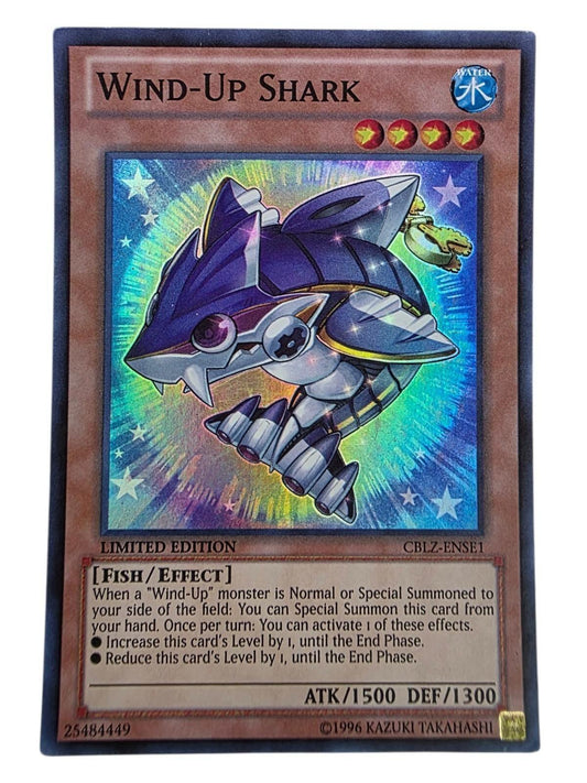 Wind-Up Shark Yu-Gi-Oh! trading card featuring a purple mechanical shark and foil finish.