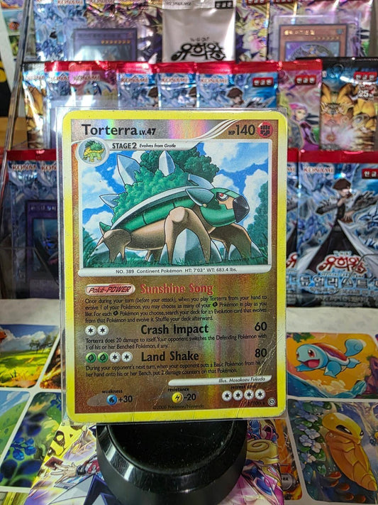 Torterra reverse holo Pokemon card with shiny foil finish against a display background.