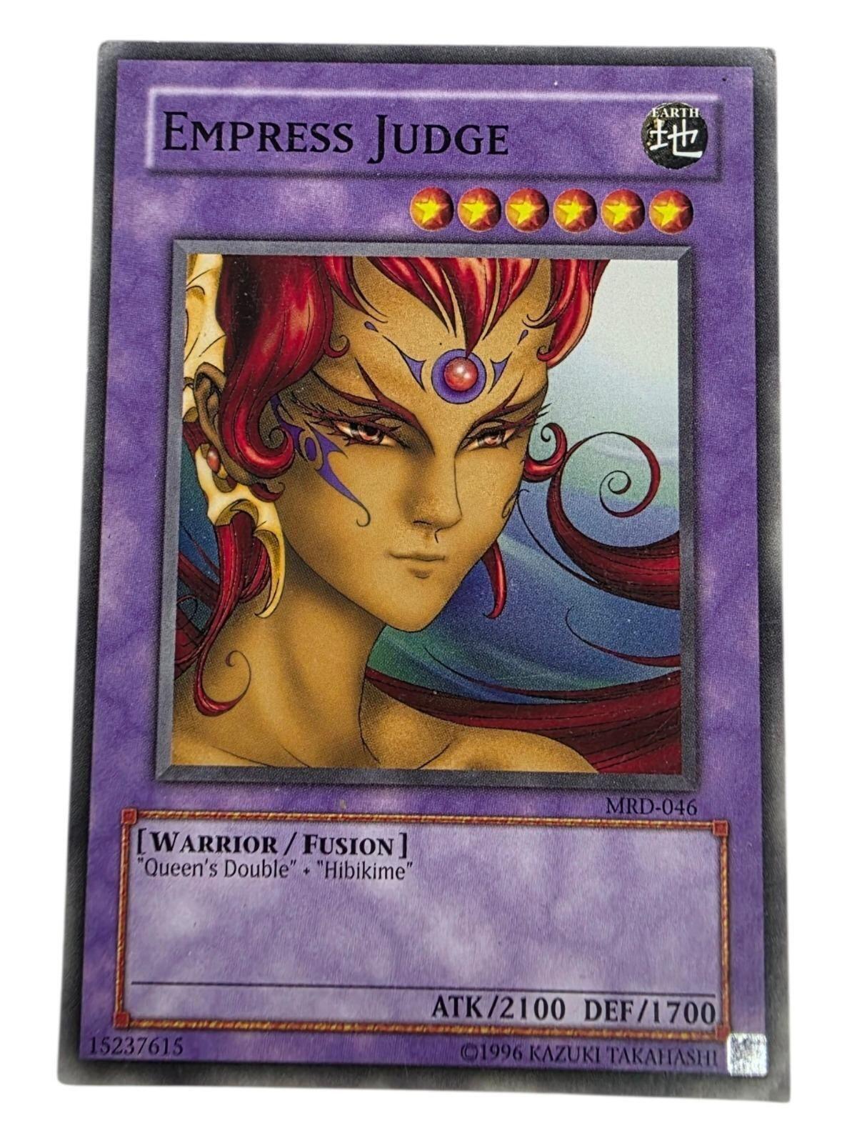 Empress Judge Yu-Gi-Oh! trading card featuring artwork of a warrior with red hair and gold skin.
