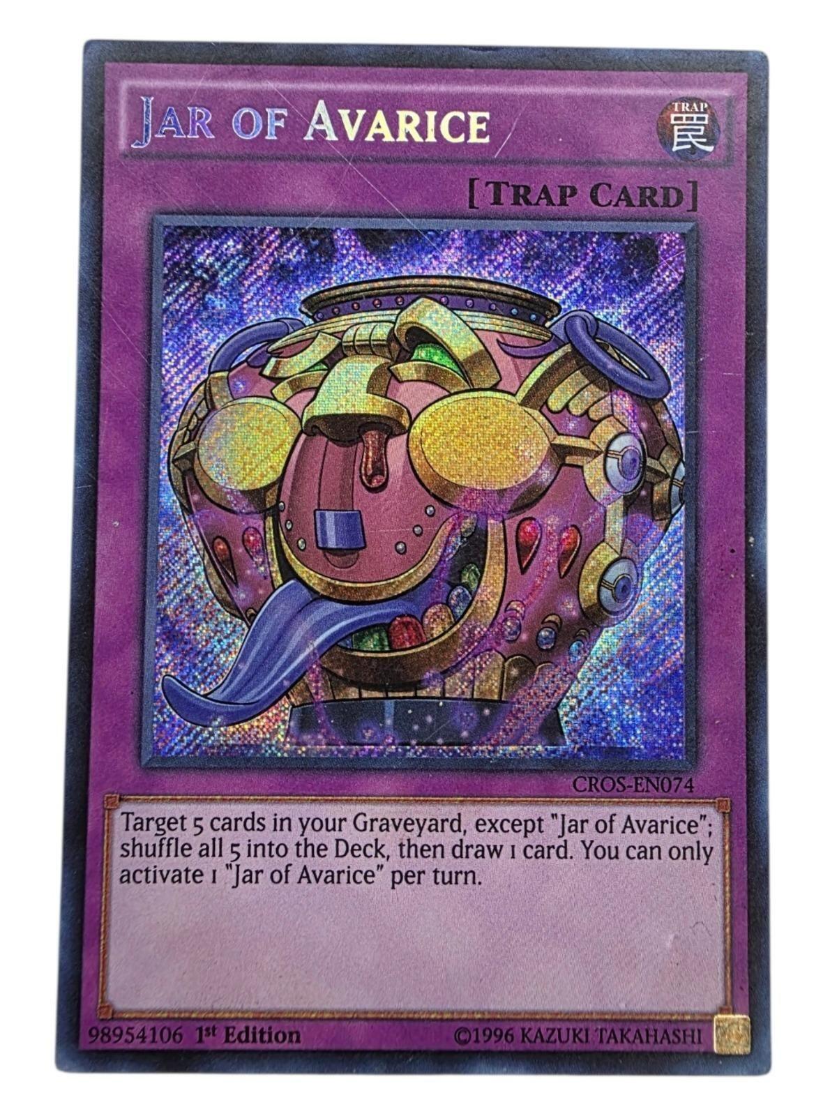Jar of Avarice Secret Rare Yu-Gi-Oh! trap card with holographic foil finish.