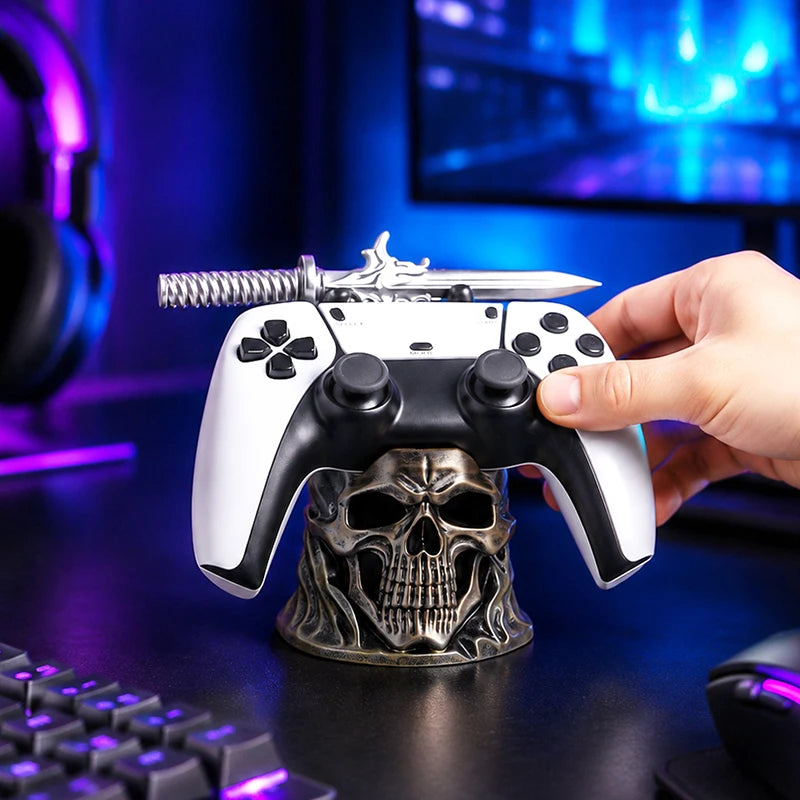 A bronze skull controller holder with a sword resting on top, holding a white and black game controller.