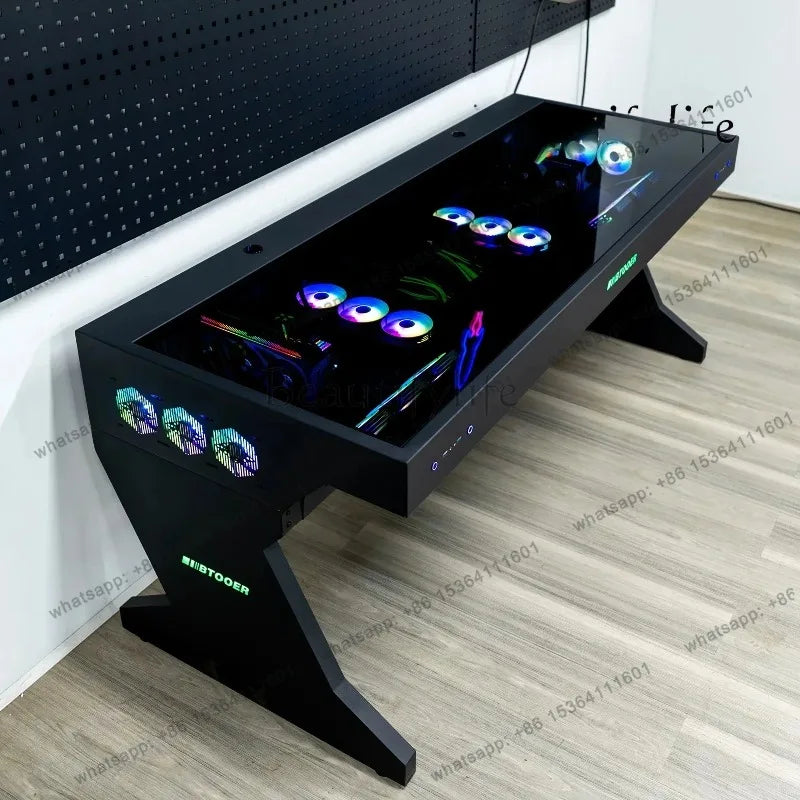 A black computer desk with a glass top reveals internal components and RGB fans, with extra fans on the side.