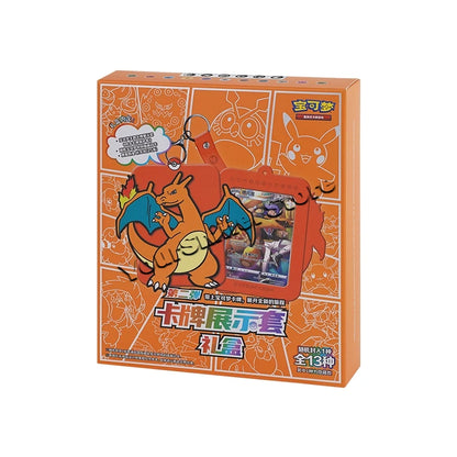 An orange Pokémon card display box set with a Charizard holder, keychain, and Chinese text.