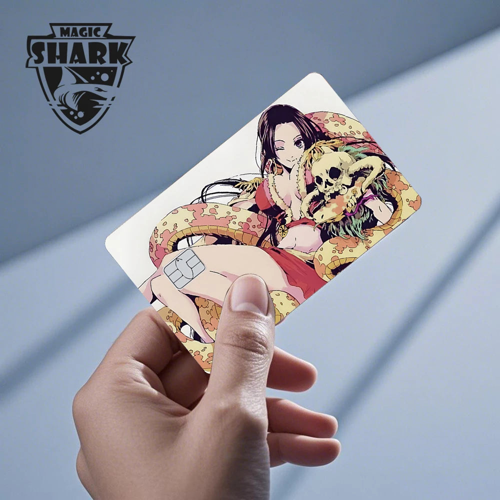 Anime debit card skin featuring an anime woman with long black hair, a yellow snake, and a skull in red and yellow.