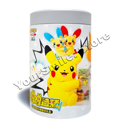 A gray cylindrical Pokemon trading card tin featuring Pikachu and Plusle and Minun plushies.